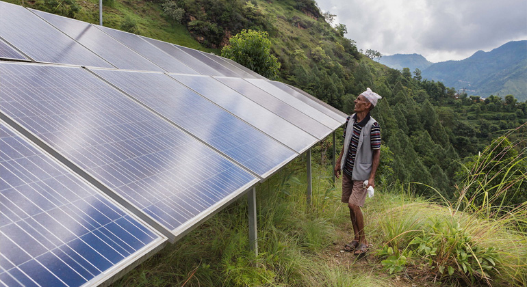 Kristin Lau | Dilli Ram Regmi stands beside the 4.5kW solar array that harnesses the sun’s energy to pump water for drinking and mushroom farming.