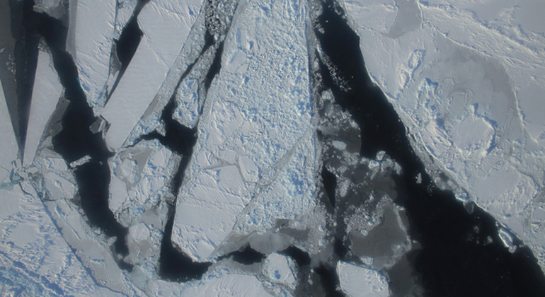 NASA/Operation Ice Bridge | This photograph from a March 27, 2015 NASA IceBridge flight shows a mixture of deformed, snow-covered, first-year sea ice floes, interspersed by open-water leads, brash ice and thin, snow-free nilas and young sea ice over the East Beaufort Sea. Nilas are thin sheets of smooth, level ice less than 10 centimeters (4 inches) thick and appear darkest when thin.