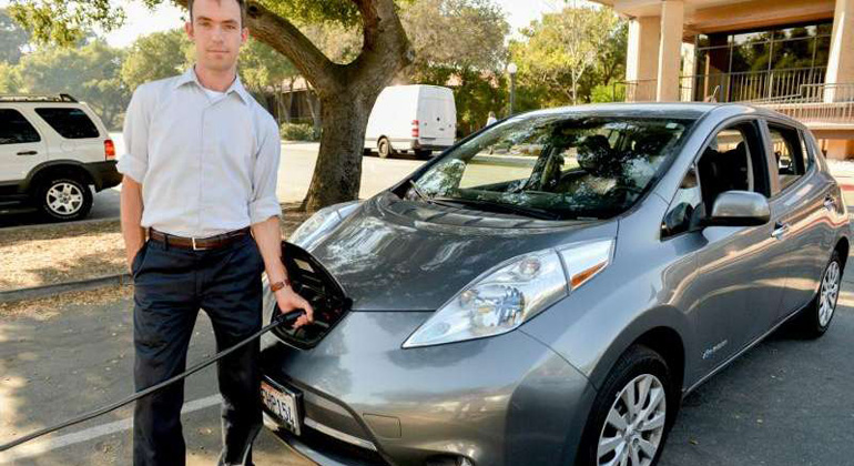 stanford.edu | Mark Schwartz | Researcher Matthew Pellow charges his all-electric Nissan Leaf at Stanford. Pellow has found that battery electric vehicles are a more cost-efficient choice for reducing carbon dioxide emissions than cars powered by hydrogen.