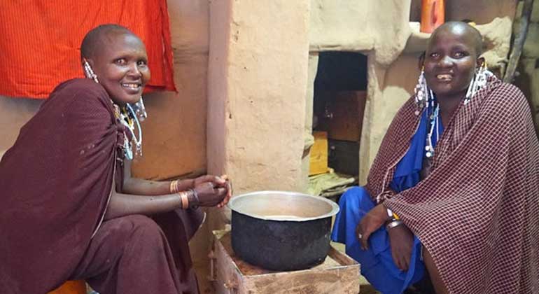 newsdeeply.com | Christabel Ligami | Loise Loseku (left) and her colleague Leah Laiza are transforming Maasai homes with electric lighting and clean stoves.