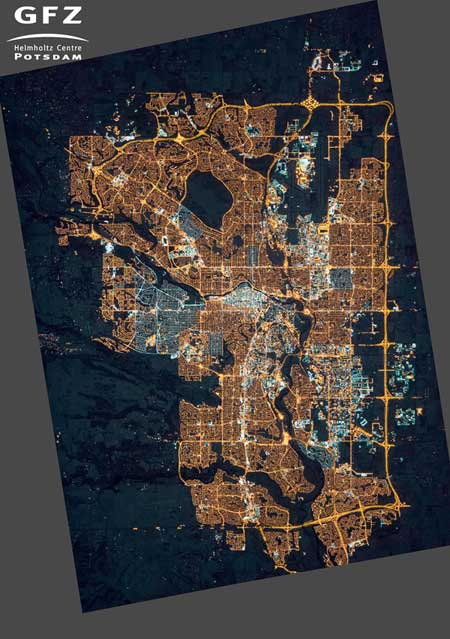 NASA’s Earth Observatory/Kyba, GFZ | Photograph of Calgary, Alberta, Canada, taken from the International Space Station on November 27, 2015. Many areas on the outskirts are newly lit compared to 2010, and many neighborhoods have switched from orange sodium lamps to white LED lamps.