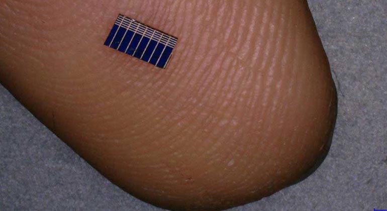 Flea-sized solar panels embedded in CLOTHES can charge a mobile phone