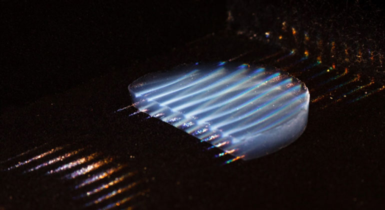 mit.edu | Photos courtesy of the researchers | The new aerogel insulating material is highly transparent, transmitting 95 percent of light. In this photo, parallel laser beams are used to make the material visible.